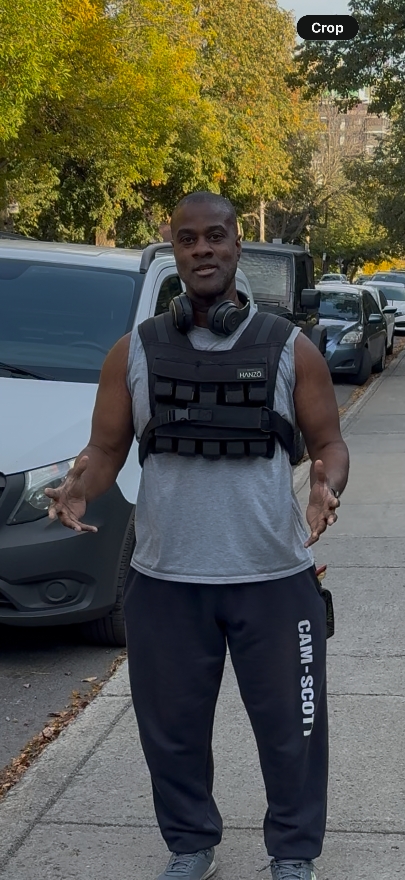 Mark walking outside wearing a weighted vest